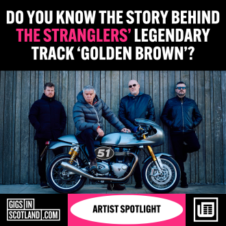 The Stranglers' standing with a motorbike